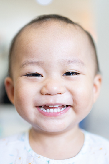 Close up of a baby grinning
